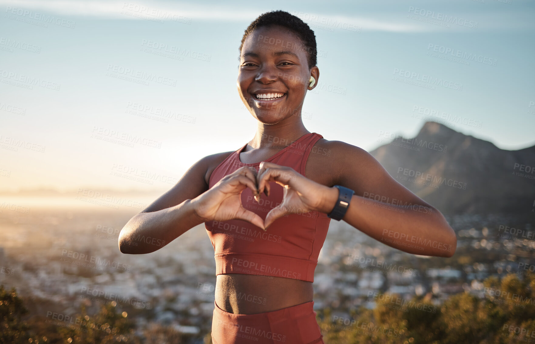 Buy stock photo Black woman, fitness and heart hands on mountain with music for outdoor sports motivation portrait, travel exercise and freedom. African woman, happy athlete and love sign for hiking with podcast