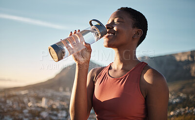Buy stock photo Black woman, runner and drinking water for outdoor exercise, training workout or marathon running recovery. African woman, healthy athlete and hydrate with bottle for fitness, health and cardio run