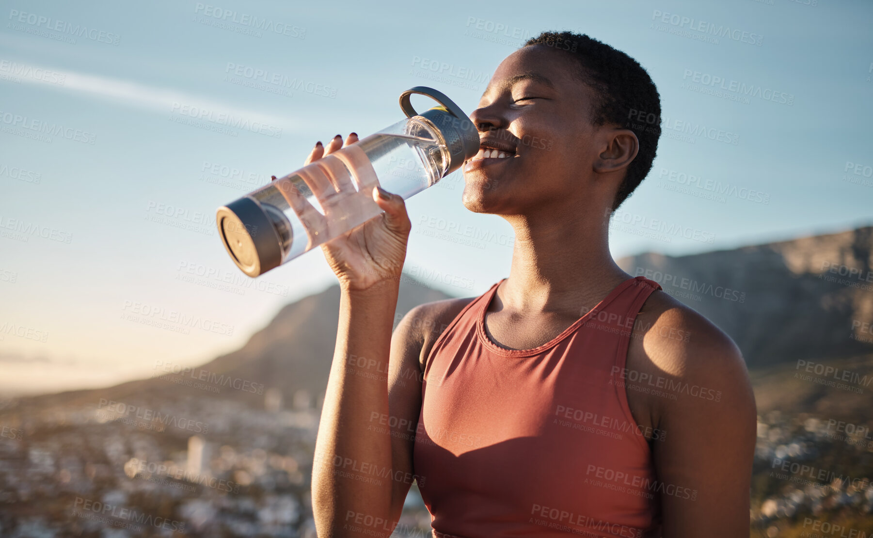 Buy stock photo Black woman, runner and drinking water for outdoor exercise, training workout or marathon running recovery. African woman, healthy athlete and hydrate with bottle for fitness, health and cardio run