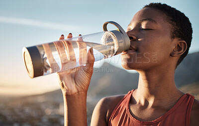 Buy stock photo Fitness, black woman and drinking water bottle after training workout, exercise and outdoor cardio running. Thirsty young athlete, sports hydration and nutrition for wellness, healthy body and energy