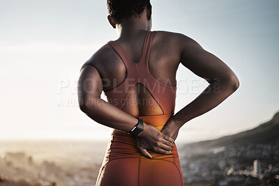 Buy stock photo Back pain, fitness and black woman with spine injury from outdoor sports training. Athlete with backache, joint pain and stress on body muscle from exercise, running and first aid health emergency 
