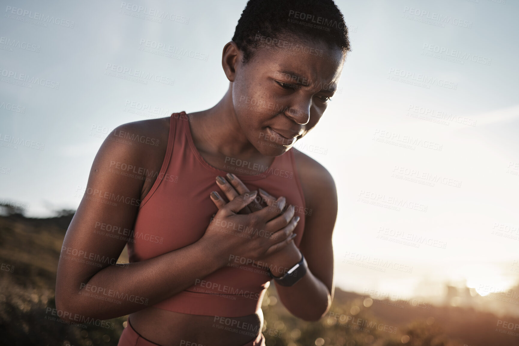 Buy stock photo Black woman, runner and heart attack pain in nature while running outdoors. Sports, cardiovascular emergency and female athlete with chest pain, stroke or cardiac arrest after intense cardio workout.