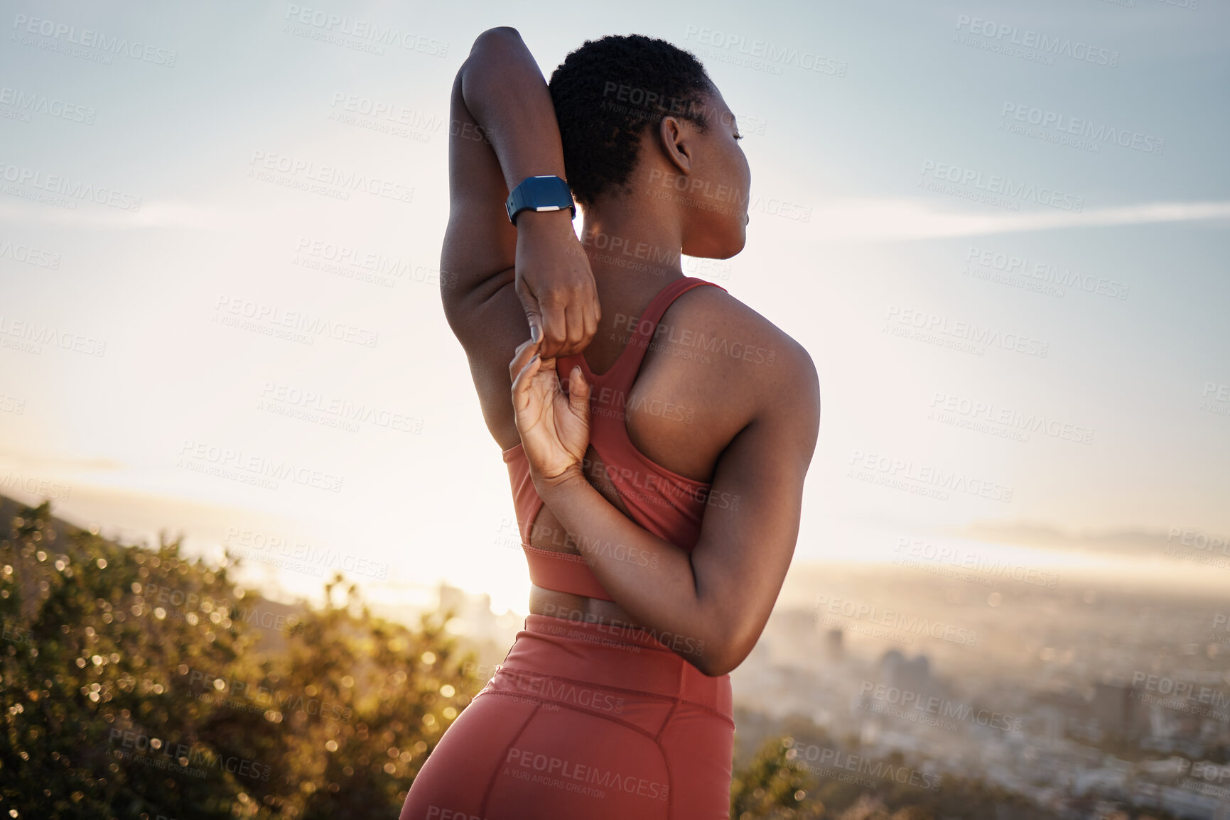 Buy stock photo Fitness, black woman and stretching arm on mountain in Cape Town for muscle wellness, healthy goals and energy. Athlete, warm up and mobility for workout, sports exercise and start training in nature