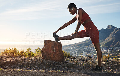 Buy stock photo Stretching legs, fitness and black woman on the mountain for training start, hiking and workout motivation in Morocco. Music, warm up and African athlete with an audio podcast for nature exercise