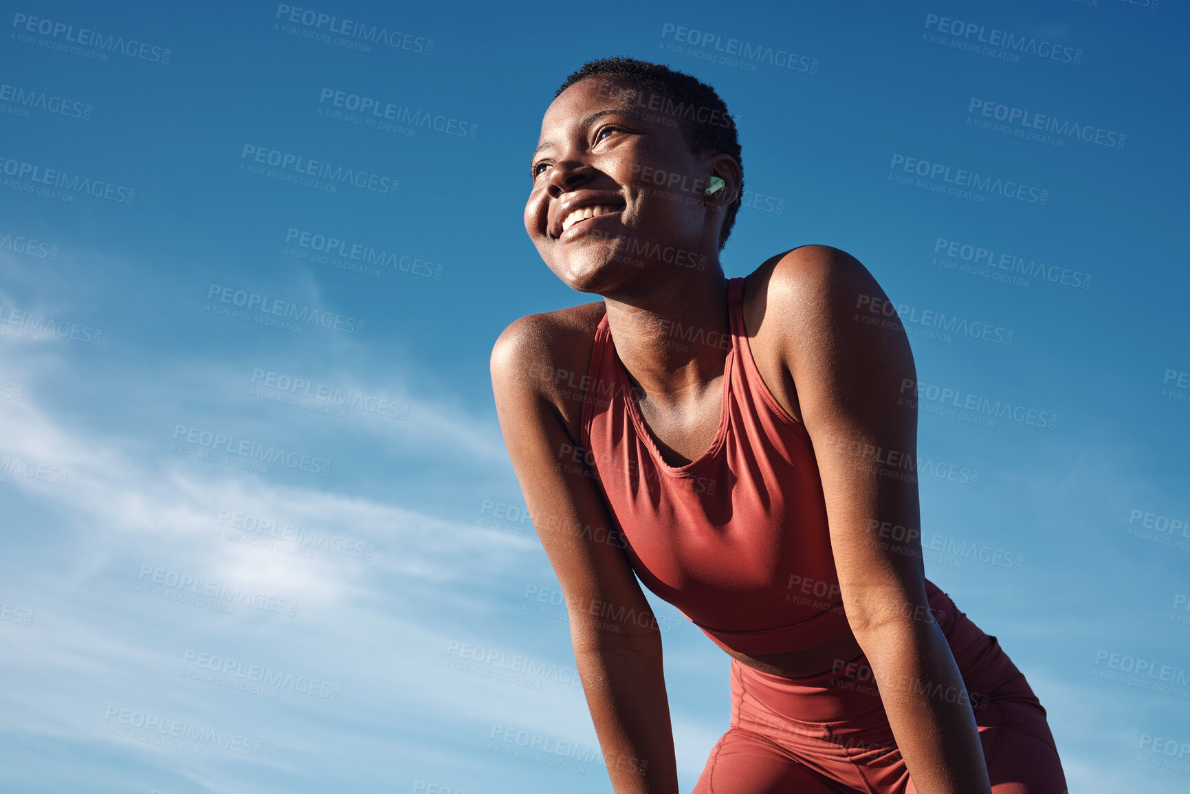 Buy stock photo Fitness, black woman and happy athlete smile after running, exercise and marathon training workout. Blue sky, summer sports and run of a African runner breathing with happiness from sport outdoor