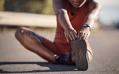 Black woman stretching foot, runner and fitness in urban street, start running with warm up and cardio for sport. Exercise outdoor, healthy active life and body workout with athlete ready for run.