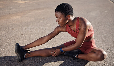 Black woman, fitness or stretching legs on city street for muscle pain relief, healthcare wellness or body tension. Runner, sports athlete or person in warm up exercise, workout or training on road