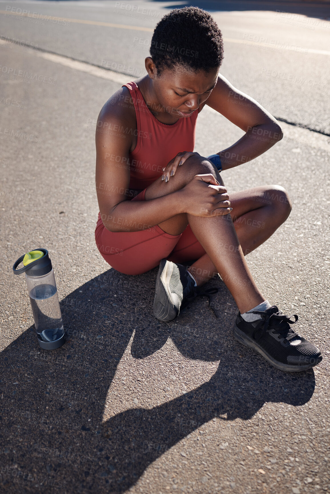 Buy stock photo Fitness, knee and black woman injury, after training and workout with agony, emergency and outdoor. African American female, runner and athlete with pain, suffering and discomfort on road and hurt.