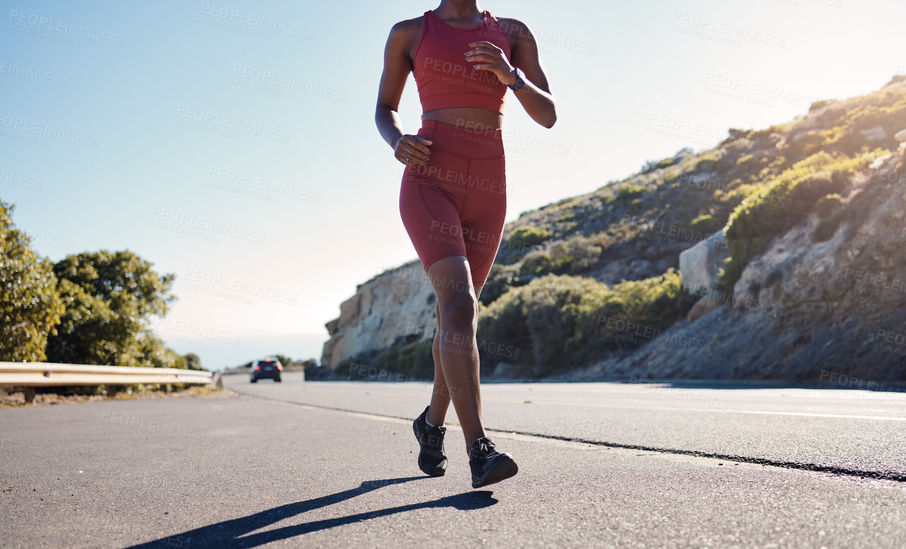 Buy stock photo Fitness, exercise and legs of black woman running on road outdoors for health or wellness. Sports, training and young female runner exercising, jog or cardio workout for strength or endurance outside