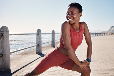 Buy stock photo Stretching legs, happy and black woman training on the promenade for running, fitness exercise and health in Indonesia. Motivation, warm up and African athlete ready for an outdoor workout by the sea