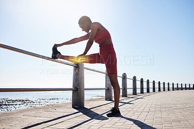 Buy stock photo Black woman, stretching legs and bone anatomy for fitness, exercise and workout at beach promenade. Athlete, body warm up and knee graphics, skeleton and glow to highlight muscle, health and joint 