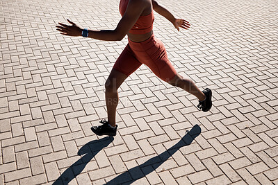 Buy stock photo Woman, fitness and running on brick street in sunshine for exercise, cardio workout and marathon training. Closeup legs of runner, athlete and energy with speed, power and action for outdoor sports 