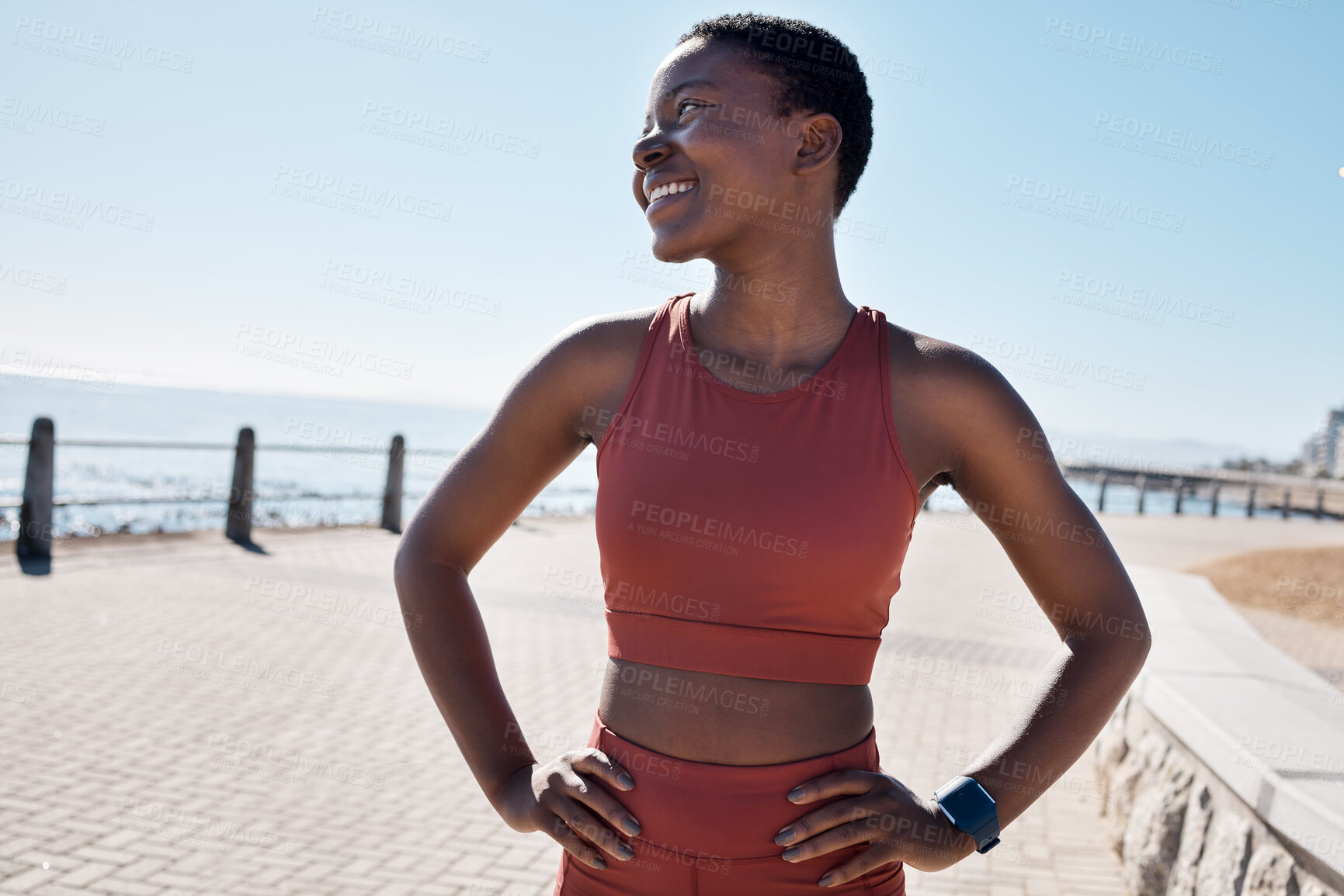 Buy stock photo Happy, fitness and black woman on the promenade for running, cardio exercise and idea for sports in Australia. Vision, smile and African runner training for a marathon, race or health by the ocean