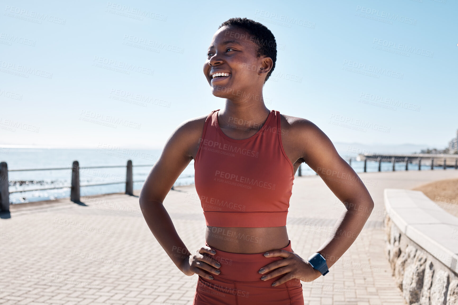 Buy stock photo Black woman runner, smile and happy by sea promenade for health, fitness and summer body goals. Happy running workout, training and exercise by ocean for wellness, muscle and development in Sydney