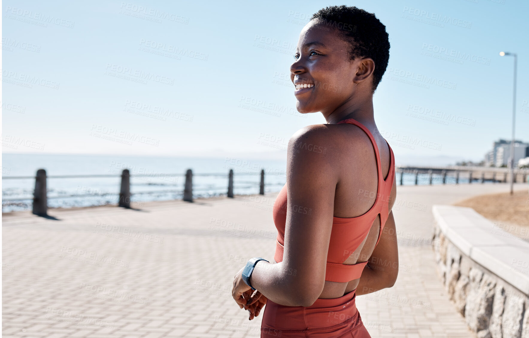 Buy stock photo Fitness, black woman and running by the sea in summer with happiness for exercise and workout. Smile, health wellness and ocean runner in the morning sun with freedom happy about training and sport