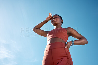 Buy stock photo Black woman, tired or sweating in fitness workout or training exercise on blue sky background in healthcare wellness. Low angle, runner or sports athlete exhausted, fatigue or marathon challenge done