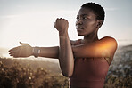 Fitness, black woman and stretching arm outdoor for muscle wellness, healthy goals and energy. Focus, athlete and warm up for workout, sports exercise and start training in nature with mindset goals