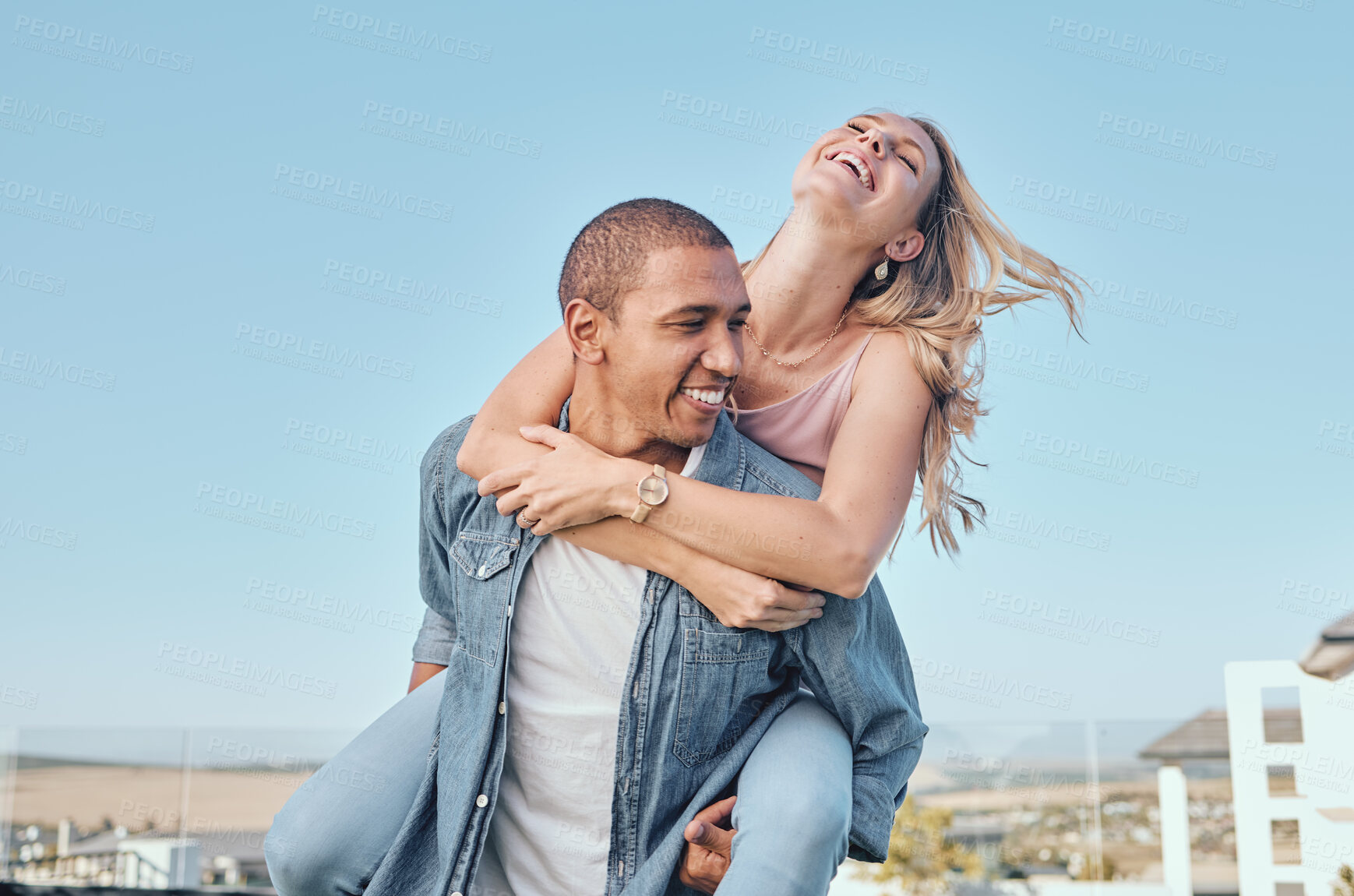 Buy stock photo Couple, interracial and love with travel and happy together, relationship with fun, piggyback ride and adventure outdoor. Black man, woman on summer holiday in Los Angeles, commitment and freedom.