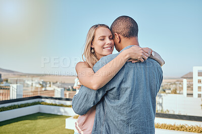 Buy stock photo Rooftop, love and couple hug in city enjoying summer holiday, weekend and vacation in Los Angeles. Romance, relationship and interracial man and woman embrace, bonding and hugging on urban adventure