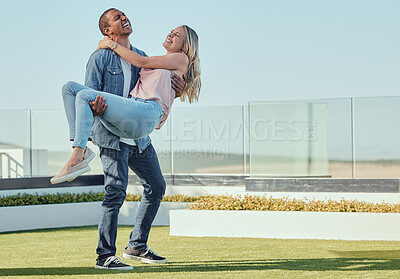 Buy stock photo Diversity, couple love and playful on rooftop for summer vacation, quality time together and marriage bonding. Interracial happy man, women and piggback laughing for fun on building balcony outdoor