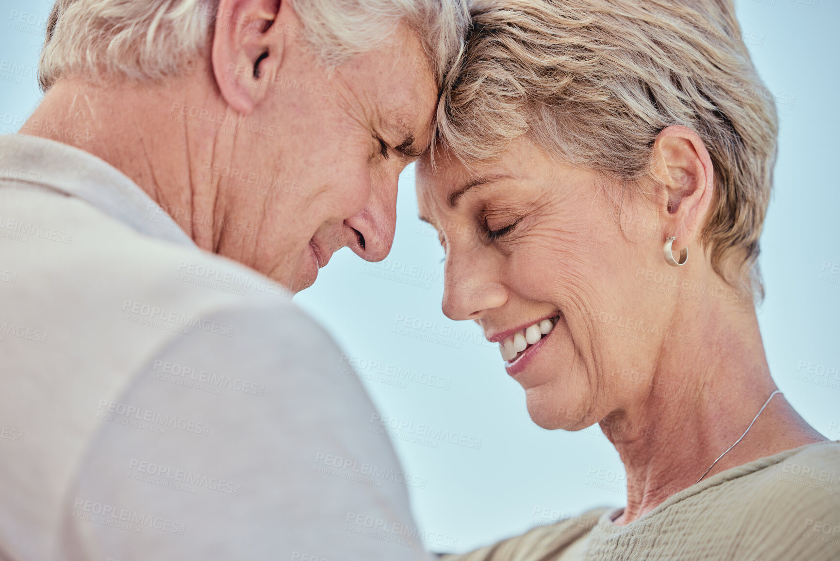 Buy stock photo Love, nature and senior couple intimate, embrace and faces together with blue sky outdoors. Retirement, marriage and elderly man and woman bonding, care and enjoy quality time, holiday and vacation