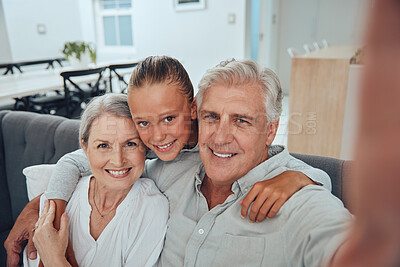 Buy stock photo Family, love and selfie on sofa in home, having fun and bonding. Hug, portrait and grandpa, grandmother and girl taking pictures for profile picture, social media and happy memory together in house