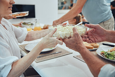 Buy stock photo Hands, lunch and potato salad in family home for healthy food, celebration or people in dining room. Family, dinner and party for food, salad plate or helping hand at table for nutrition to celebrate