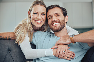 Buy stock photo Couple, sofa and portrait for hug, smile and love for romance, relax and holding hands in living room. Happy couple, man and woman with embrace by couch, lounge and happiness at house in Los Angeles