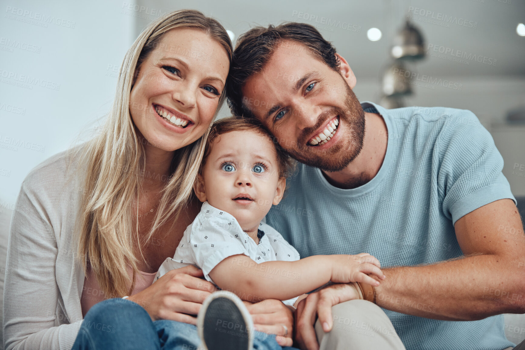Buy stock photo Happy, smile and portrait fo family on sofa for bonding, affectionate and quality time. Relax, support and care with face of parents and baby in living room at home for calm, health and happiness