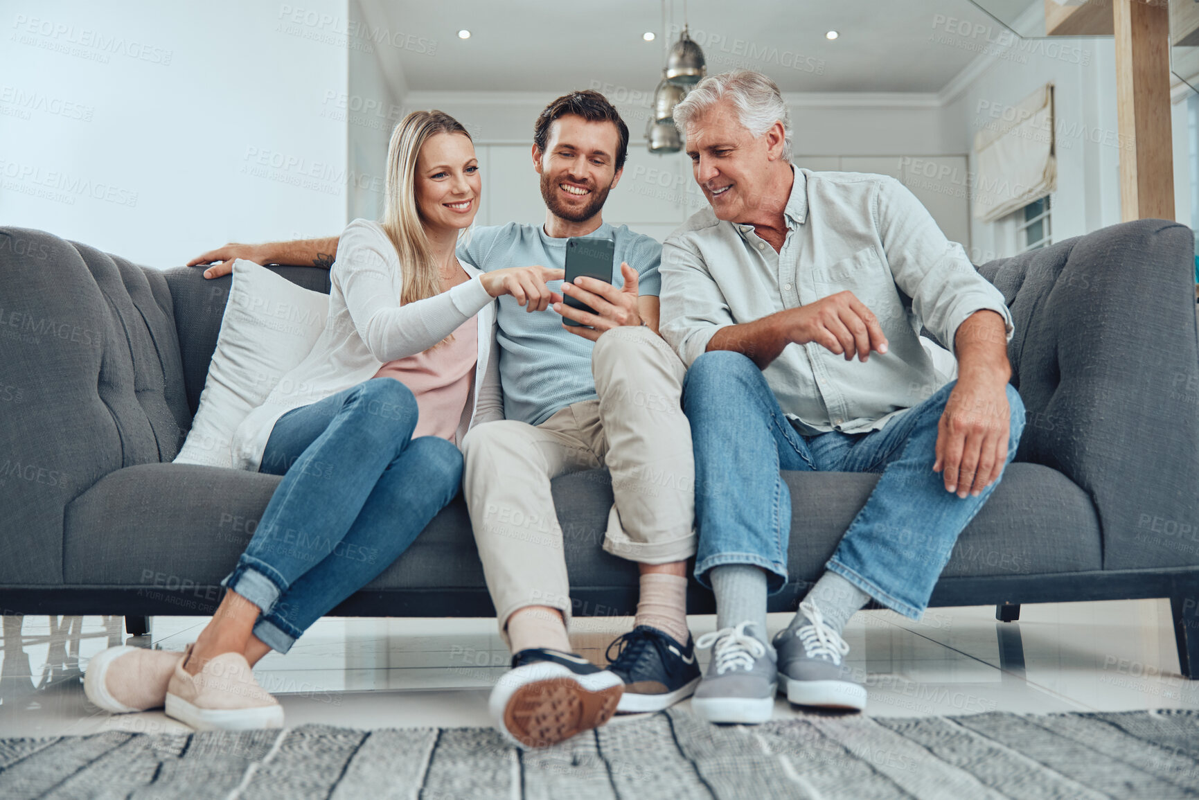 Buy stock photo Relax, search and phone with family on sofa for share internet, social media or online news. Care, retirement and help grandfather with man and woman in living room for technology, digital or contact
