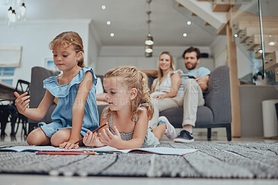 Buy stock photo Relax, children drawing and parents on sofa in the living room bonding, resting and watching the kids. Education, family and girls doing homework on the floor with mother and father sitting on couch.