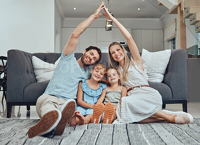 Buy stock photo Family home, portrait and roof hands with smile, parents and happiness by sofa in living room together. Young happy family, kids and floor with love, bonding and care on lounge carpet in Los Angeles