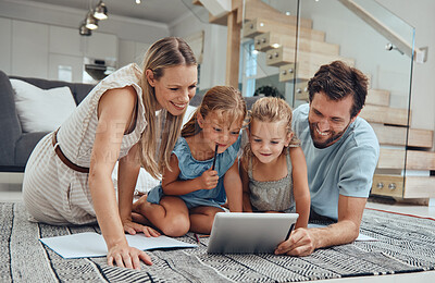 Buy stock photo Family, online learning and kids with tablet in living room, studying and bonding with parents. Homework, distance learning and education with father, mother and girls watching educational video.