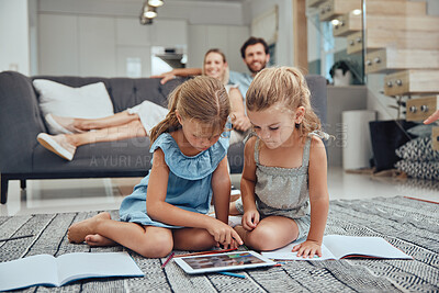 Buy stock photo Living room, parents relaxing and children doing elearning on tablet in books on the floor in their home. Mother, father and girl kids sitting in lounge together for homeschool learning and studying.