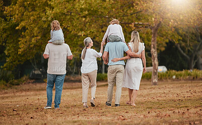 Buy stock photo Big family, park and nature walking of mother, grandparent and children with love and care. Happy family, outdoor and autumn field walk on vacation with grandmother, dad and girl back together
