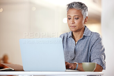 Buy stock photo Office, coffee and mature woman with laptop typing idea for creative startup business or report at desk. Senior freelance worker, designer or writer, thinking and working on ideas in modern office