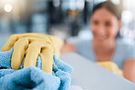 Hand, woman and table cleaning for hygiene, housework and household cleansing in an apartment. Hands, girl and clean product for dust, dirt and germs, bacteria and illness prevention on surface