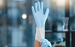 Hands, cleaning gloves and woman in home getting ready for hygiene at night. Spring cleaning, cleaning service and maid, worker or cleaner preparing to start washing or disinfection in dark house