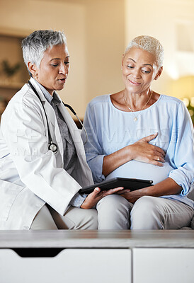 Buy stock photo Pregnant, woman and senior ivf doctor on tablet for planning, results and discussion on sofa during home checkup. Healthcare, pregnancy and consulting with mature doc while checking online plan
