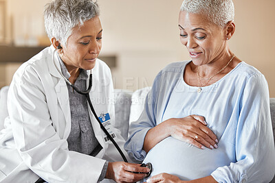 Buy stock photo Pregnant, consulting and doctor with woman on a sofa for medical checkup, health and exam during home visit. Healthcare, pregnancy and senior fertility expert doing wellness check on lady in hospital