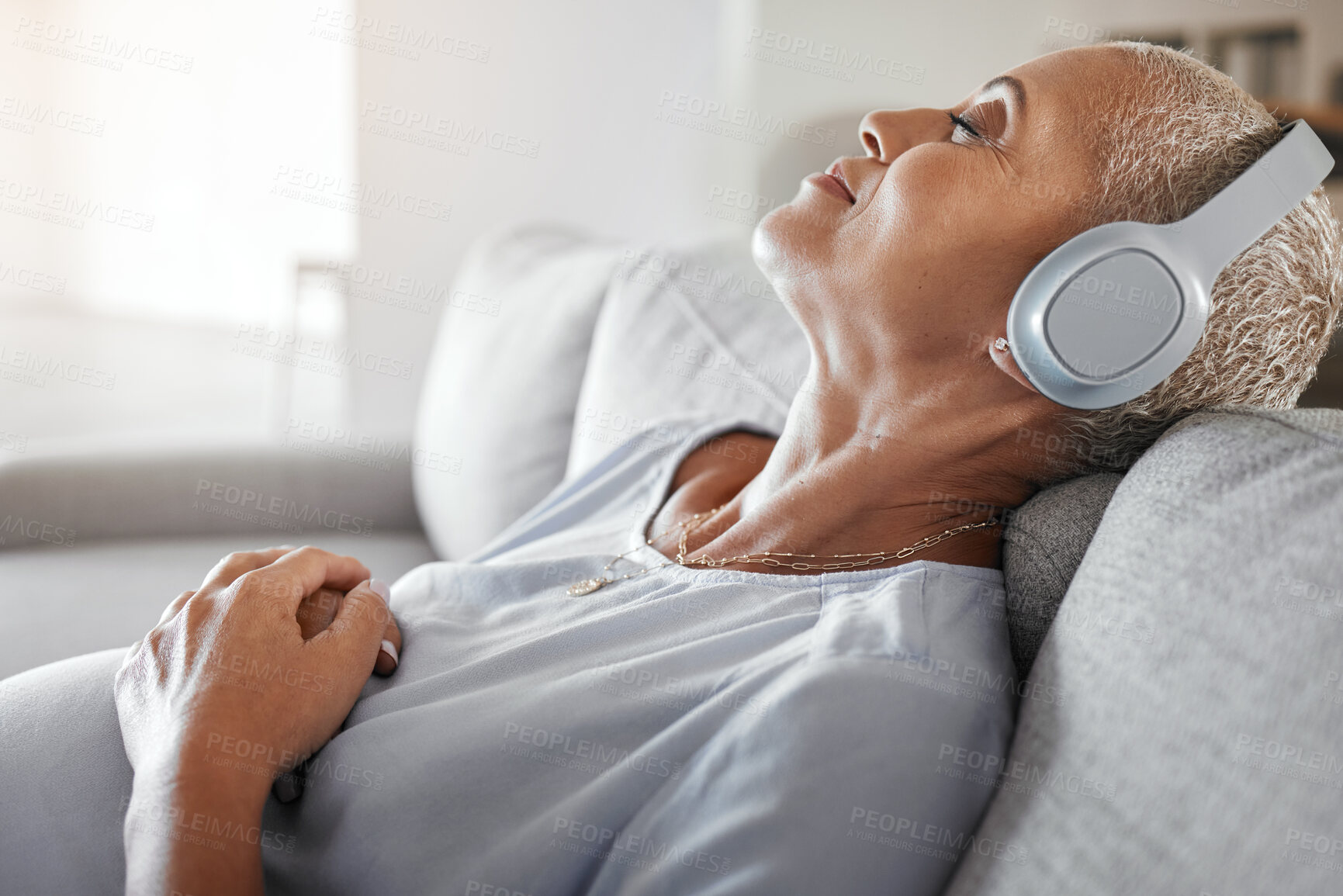 Buy stock photo Relax, music and pregnant with black woman on sofa for peace, health or online streaming service. Podcast, audio and mobile radio with lady listening to headphones for pregnancy, freedom and wellness
