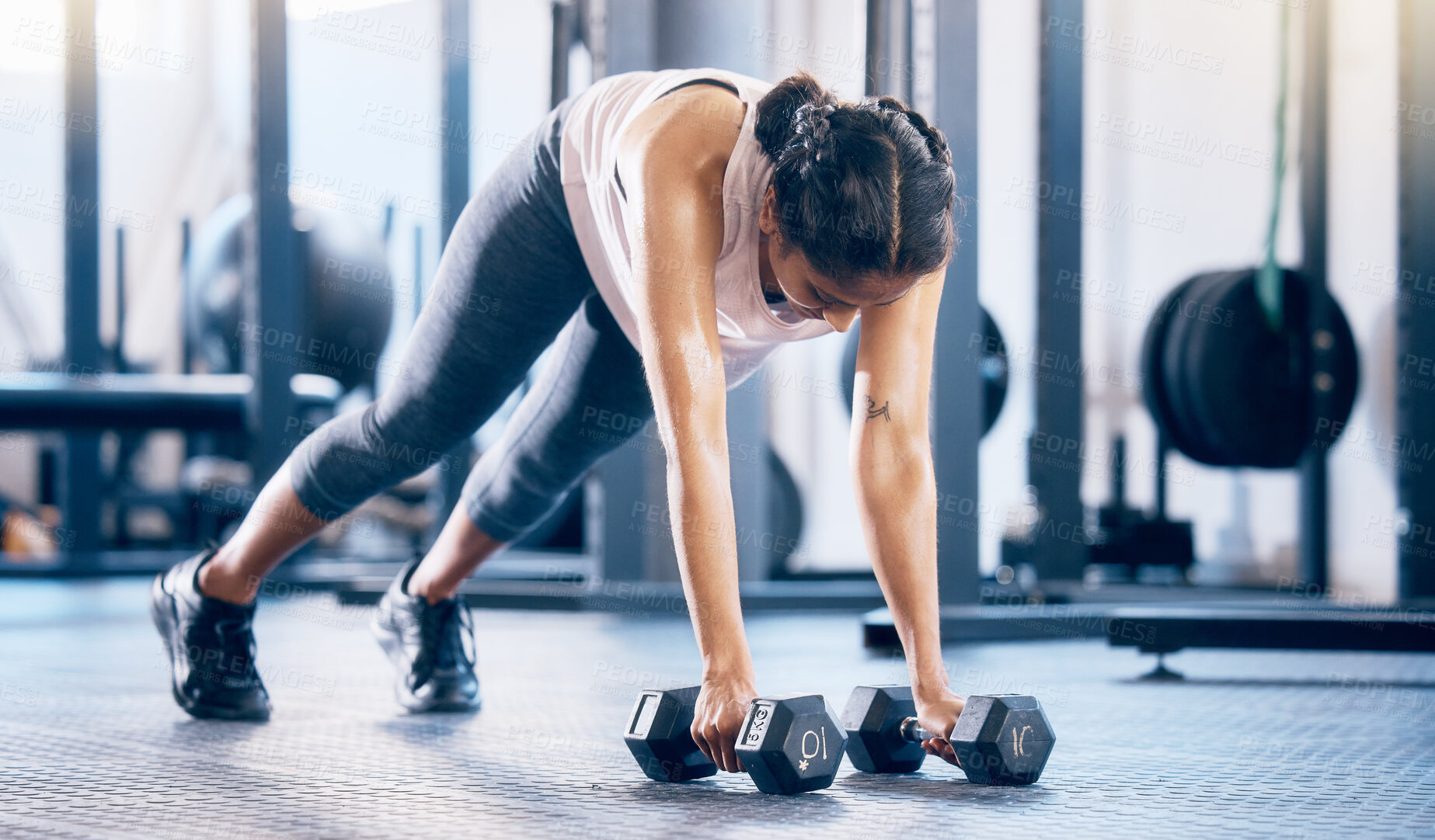 Buy stock photo Dumbbell, fitness and training with woman in gym and push up for health, performance and challenge. Workout, wellness and strong with girl athlete and ground exercise for muscle, endurance and energy