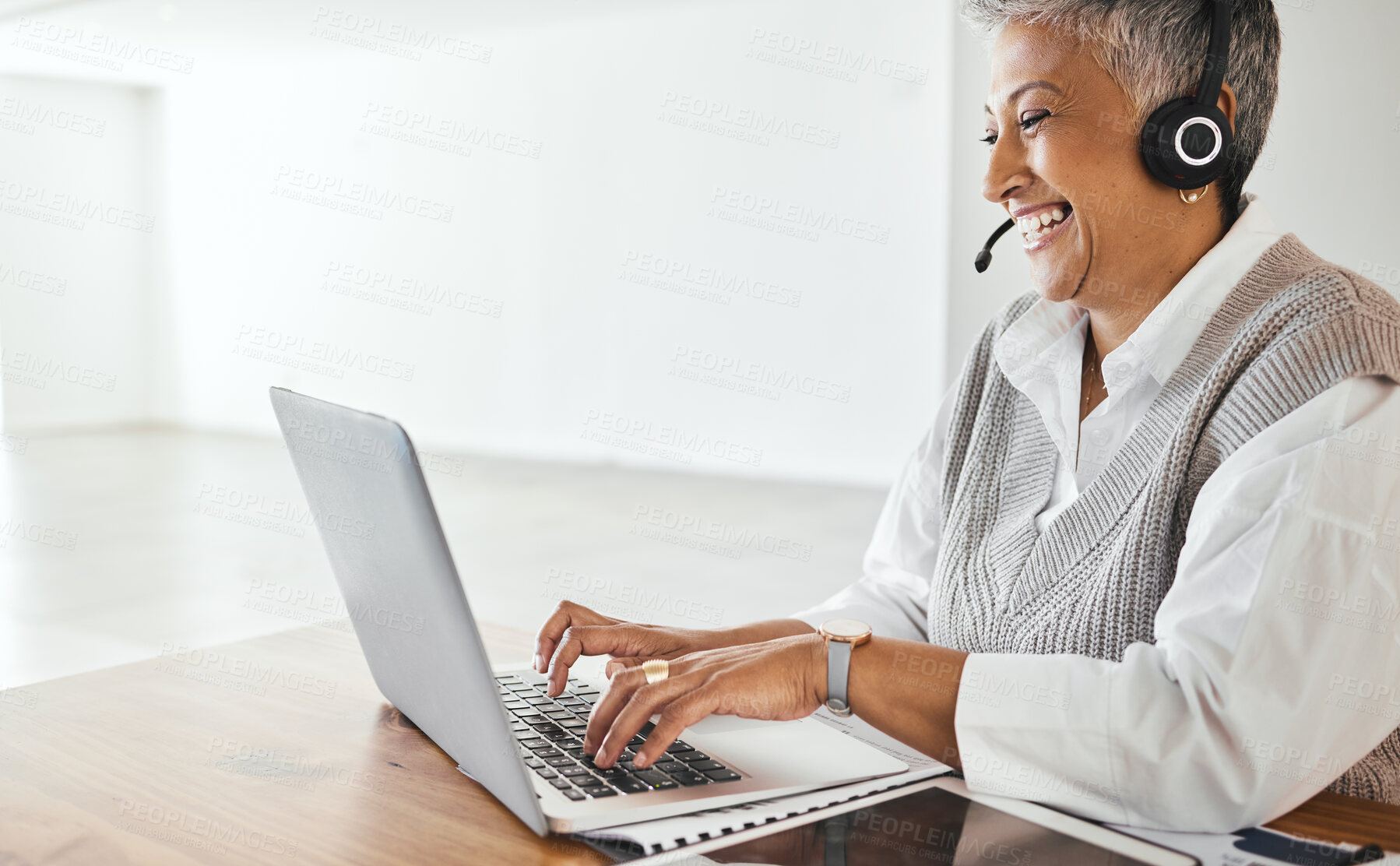 Buy stock photo Call center, laptop or happy senior consultant laughing at a funny joke typing an email for customer services feedback. Crm, remote work or telemarketing manager consulting, talking or helping client