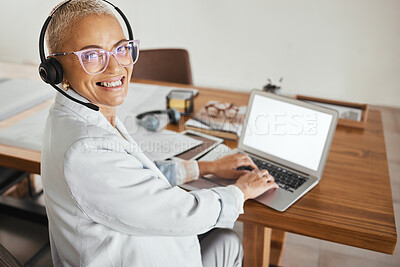 Buy stock photo Mature business woman, laptop or call center headset in home office, telemarketing company or b2b sales startup on mockup screen. Portrait, happy smile or customer support manager on crm technology