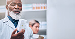 Pharmacy, black man and hand of pharmacist with medicine box mock up. Pills, medication and senior male medical professional with drugs for prescription, healthcare and wellness, cure or treatment.