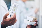 Pharmacy, black man and hand of pharmacist with medicine boxes. Pills, medication and male medical professional with drugs for prescription, healthcare and wellness, cure or treatment in drug store.