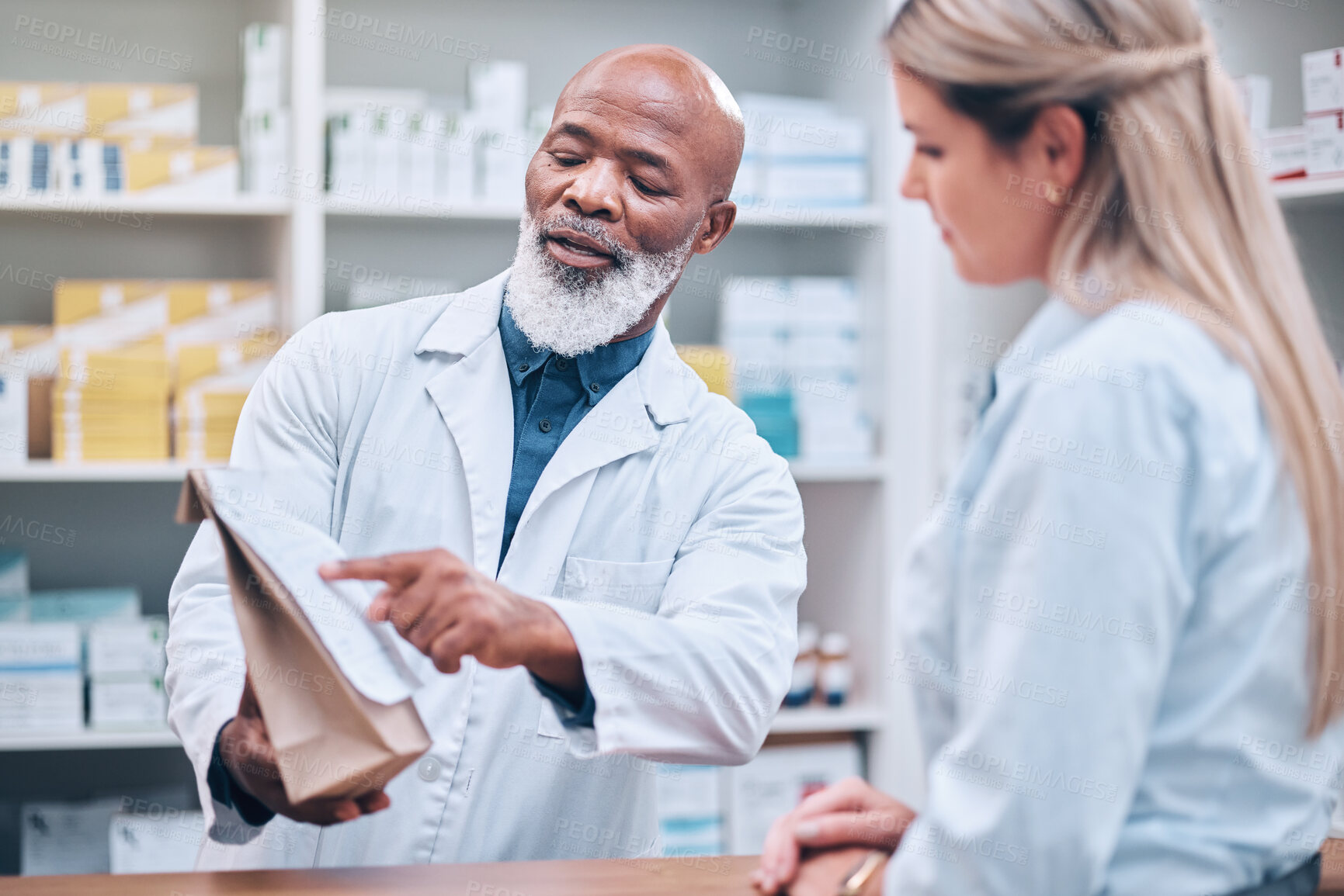 Buy stock photo Pharmacist, medicine and help for woman customer at the counter for pills, help and information on treatment. Pharmacy, consulting and girl asking questions from healthcare worker, advice and trust