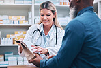 Healthcare, pharmacist and man at counter, medicine, prescription drugs and happy service at drug store. Health, wellness and medical insurance, black man and woman at pharmacy for advice and pills.