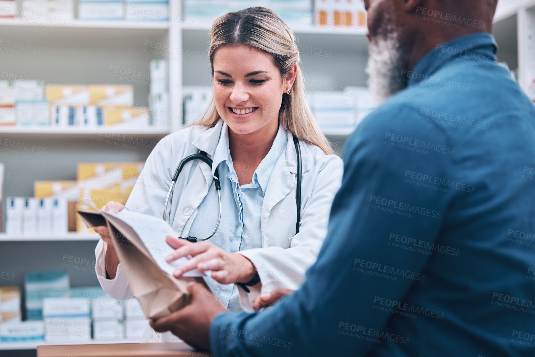 Buy stock photo Healthcare, pharmacist and man at counter, medicine, prescription drugs and happy service at drug store. Health, wellness and medical insurance, black man and woman at pharmacy for advice and pills.