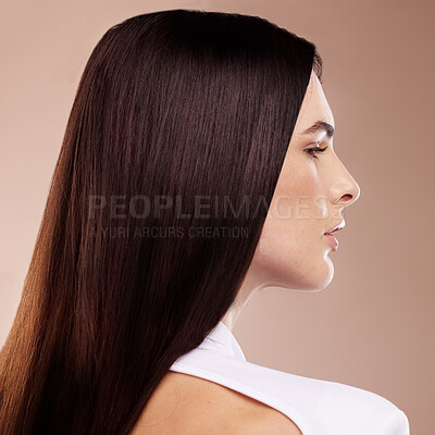 Buy stock photo Face profile, beauty and hair care of woman in studio isolated on a brown background. Balayage, hairstyle and young female model with healthy, beautiful and long hair after salon treatment for growth